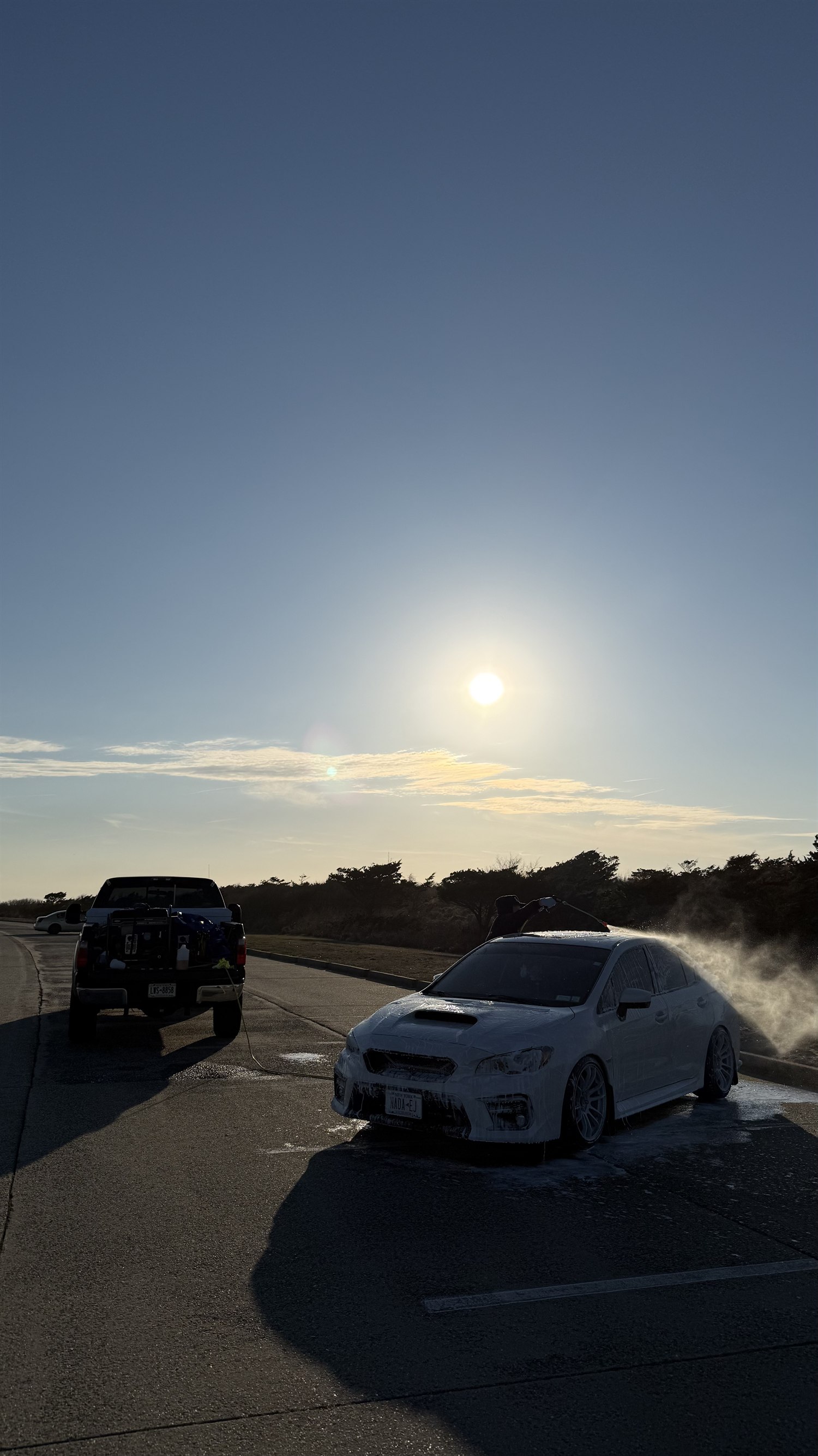 Subaru WRX foam wash at sunset